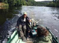 Boat Fishing The River For Salmon 
